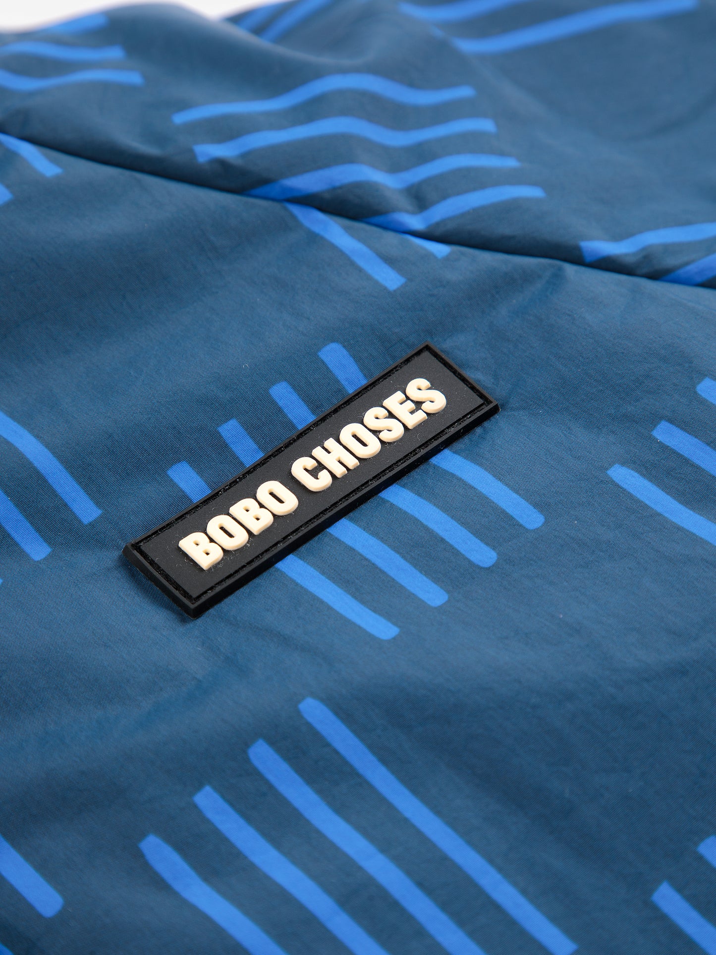 Almost Moiré all over reversible anorak